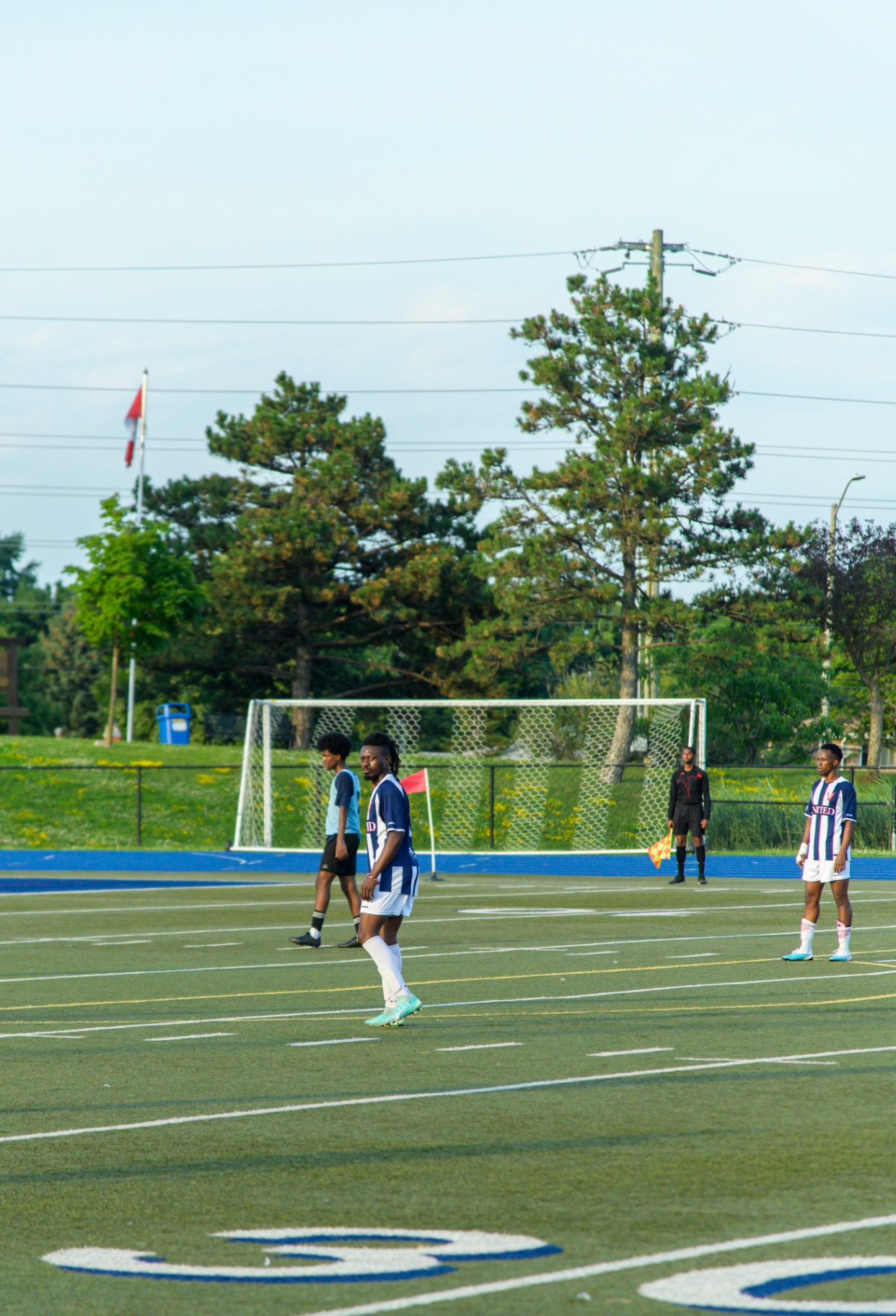Wide view of the match near the corner flag