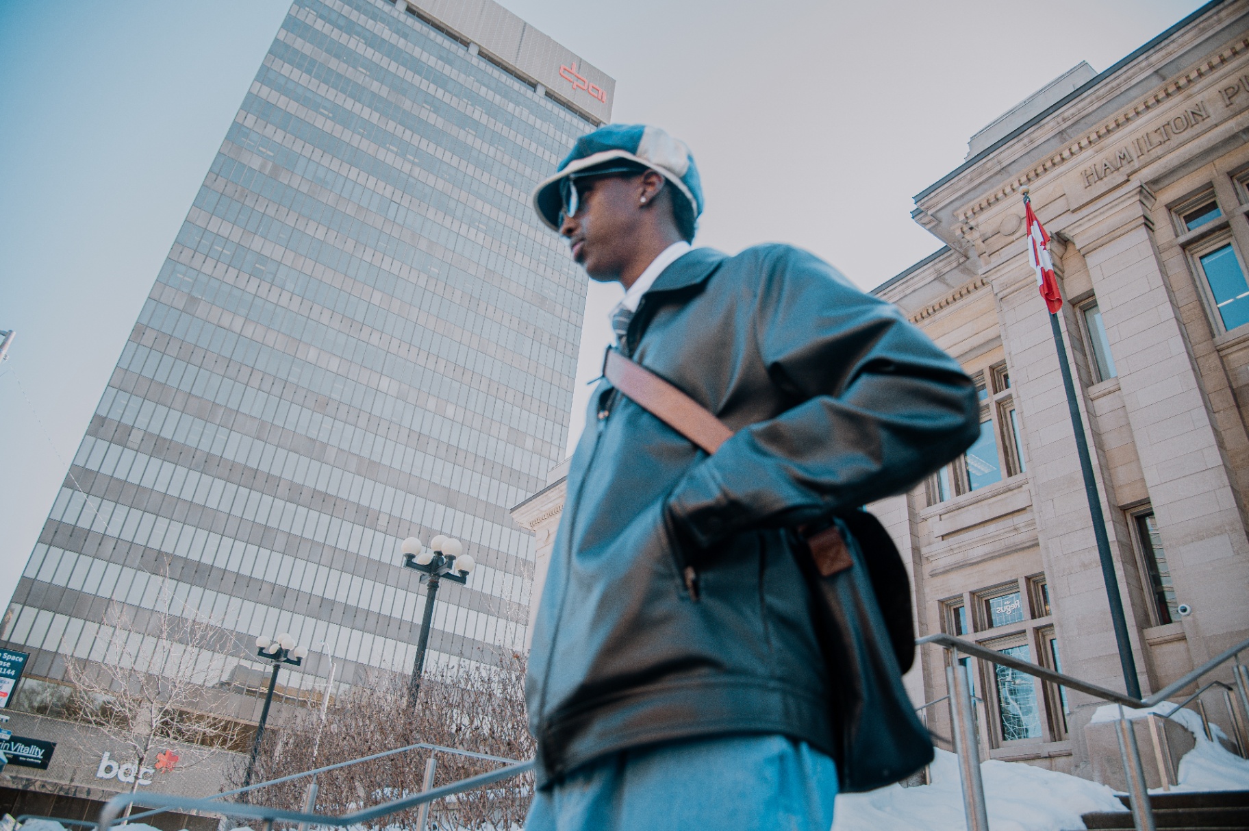 Low-angle street portrait in front of the BDC tower