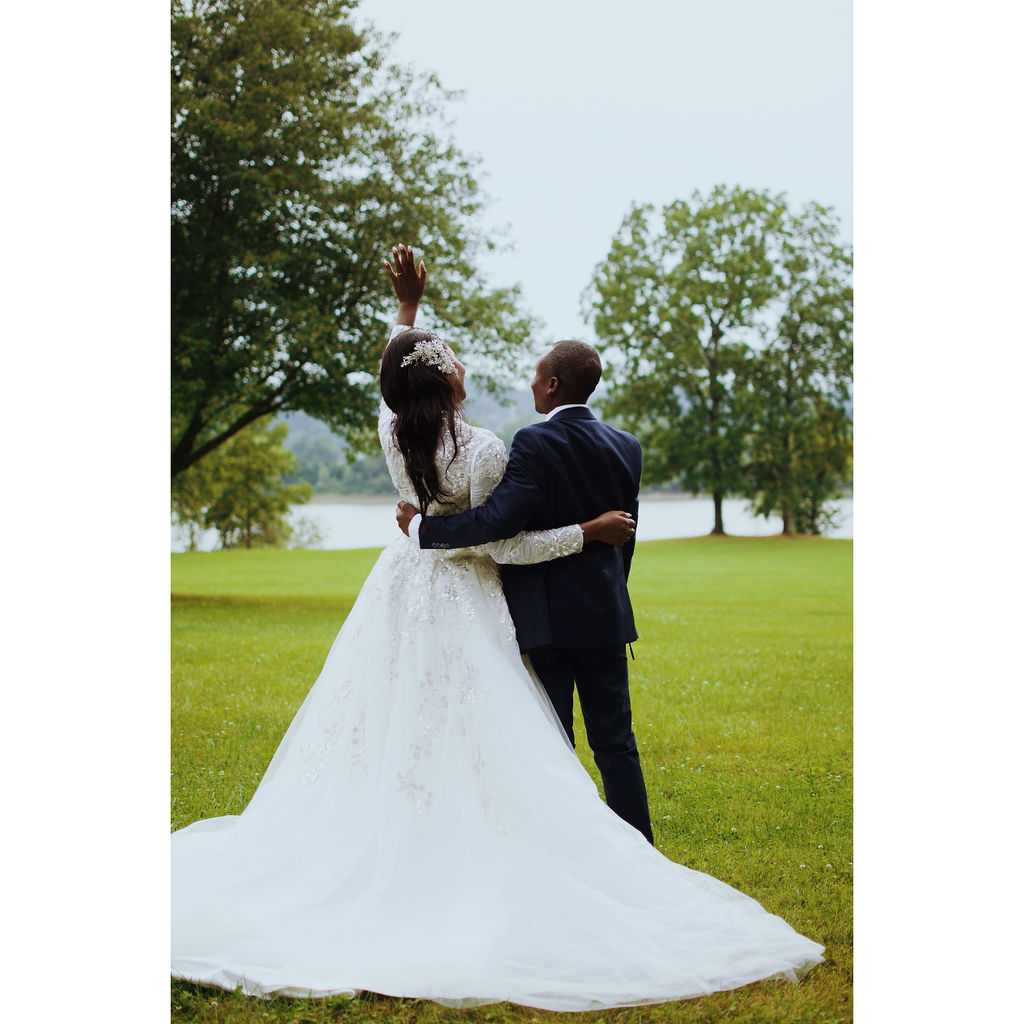 Bride and groom on the chapel lawn