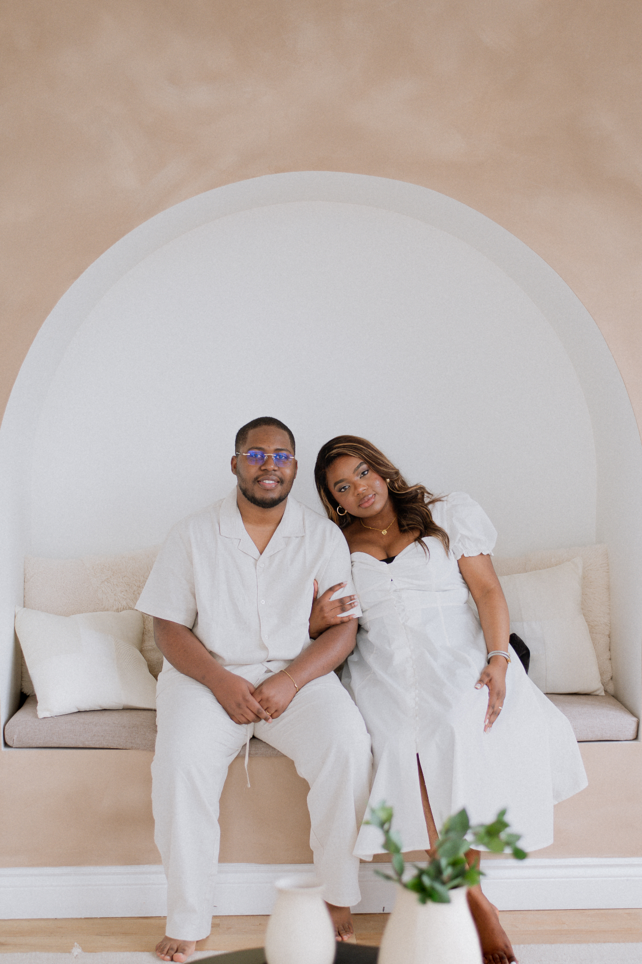 Couple seated in the arched studio nook