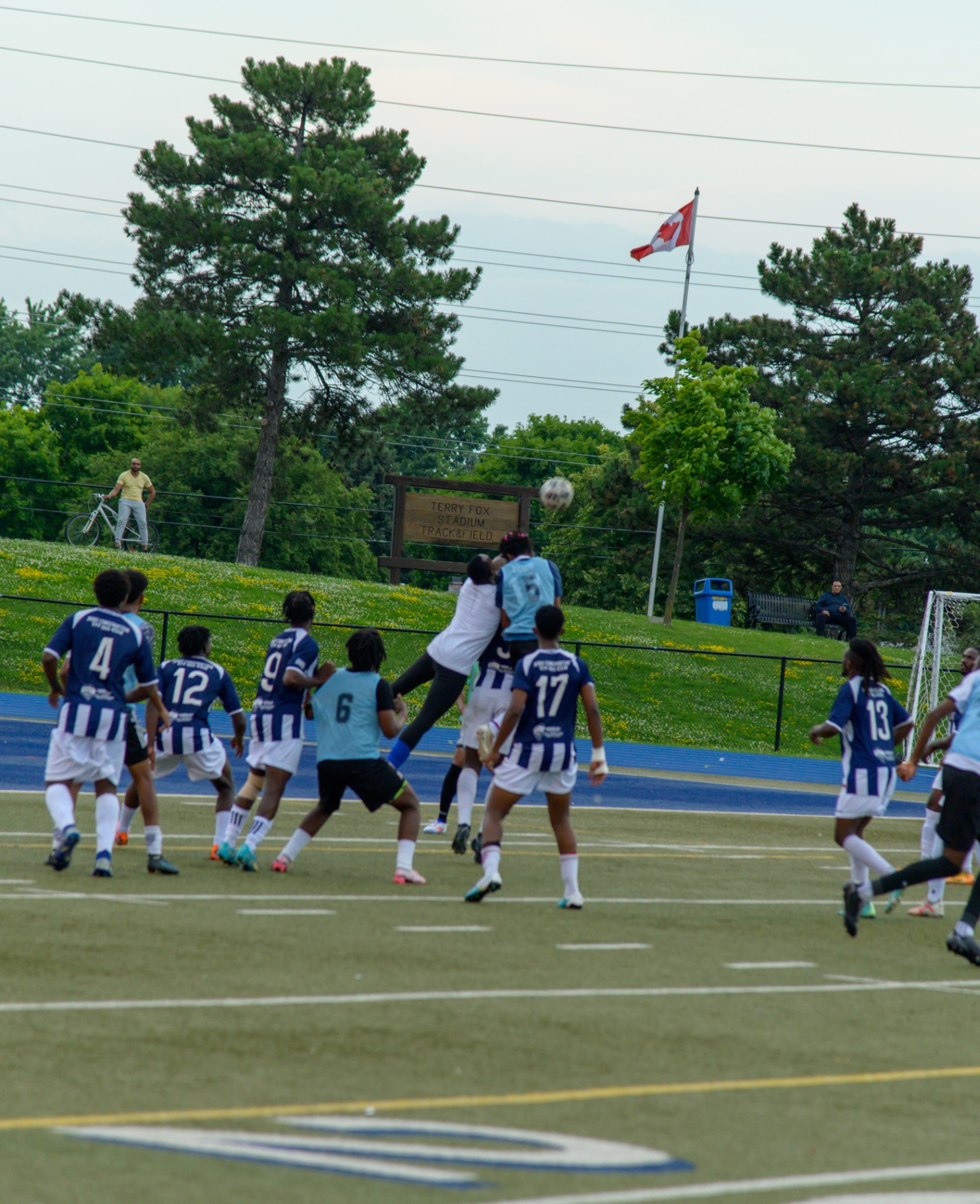Goalkeeper punches away a corner at Terry Fox Stadium