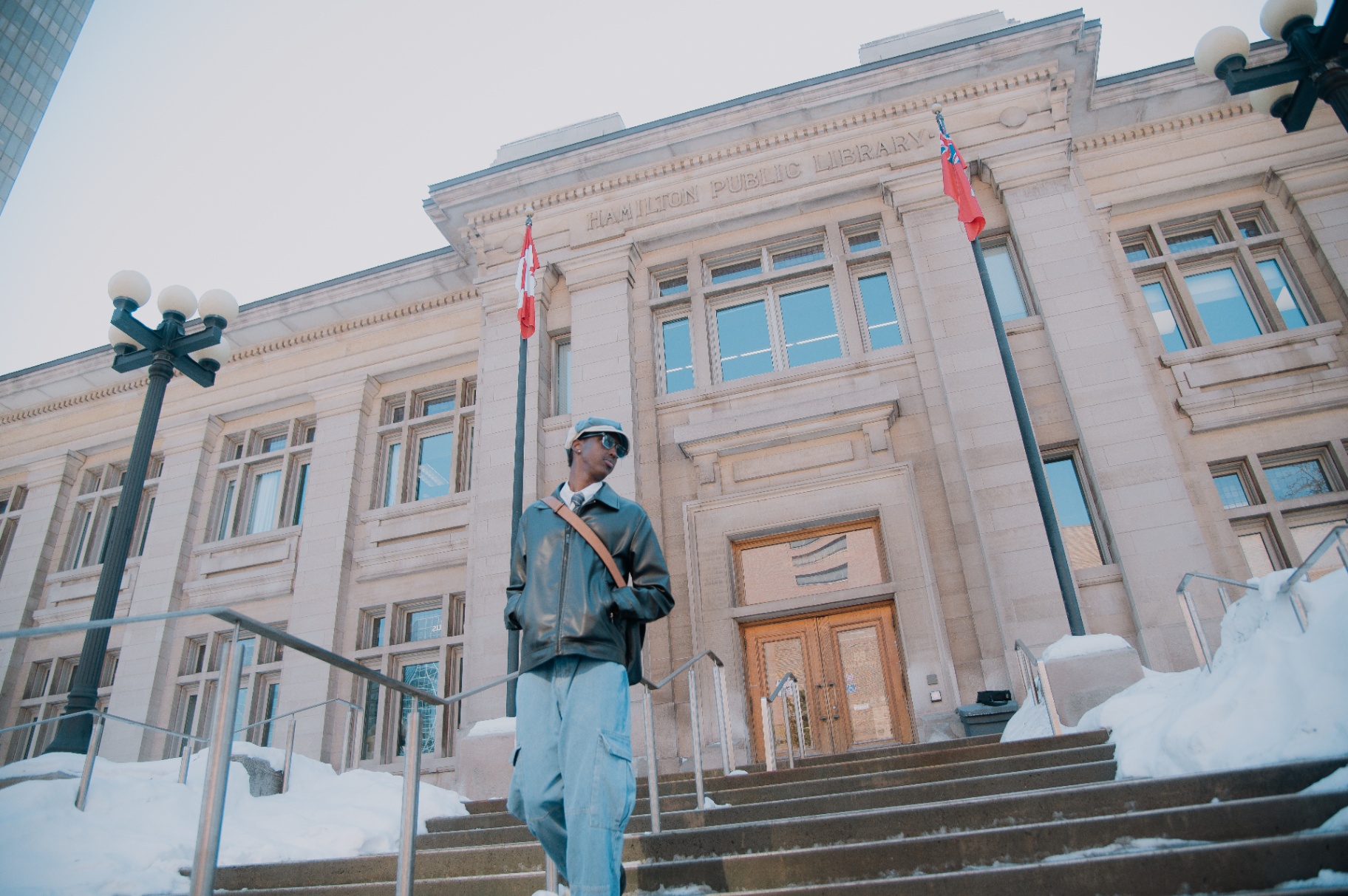 Walking down the library steps with hands in pockets