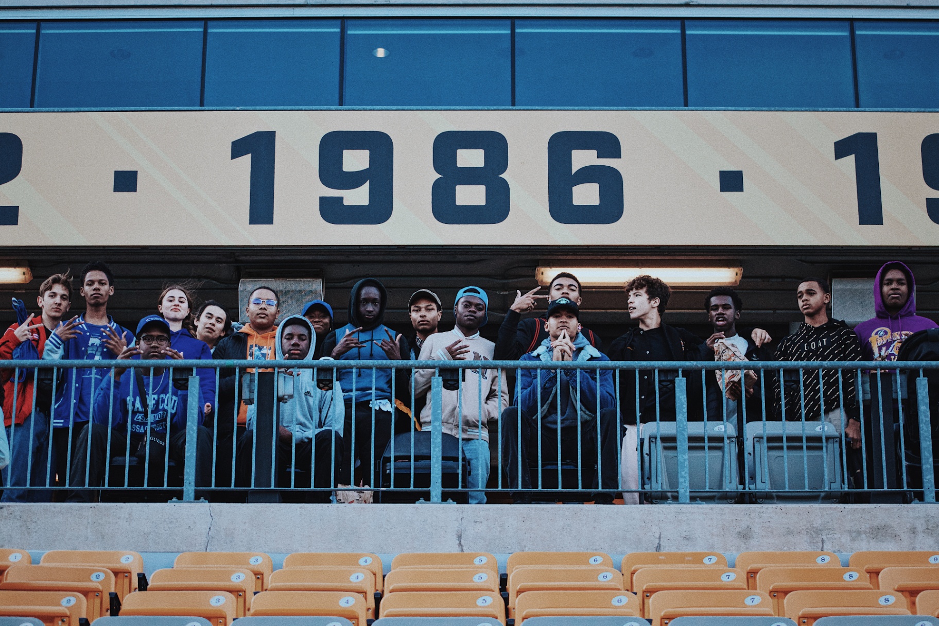Group of supporters posing in the bleachers