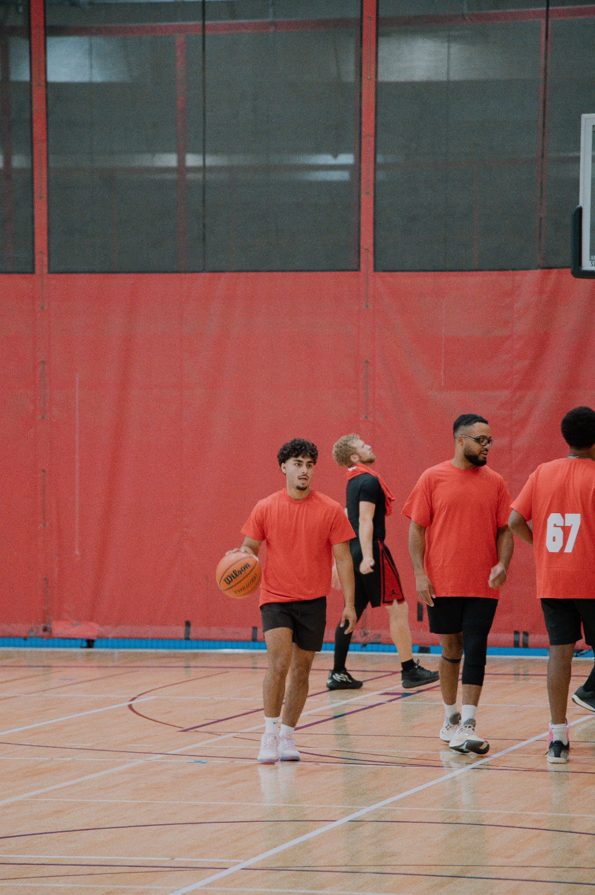 Red team walking up the floor after a stop