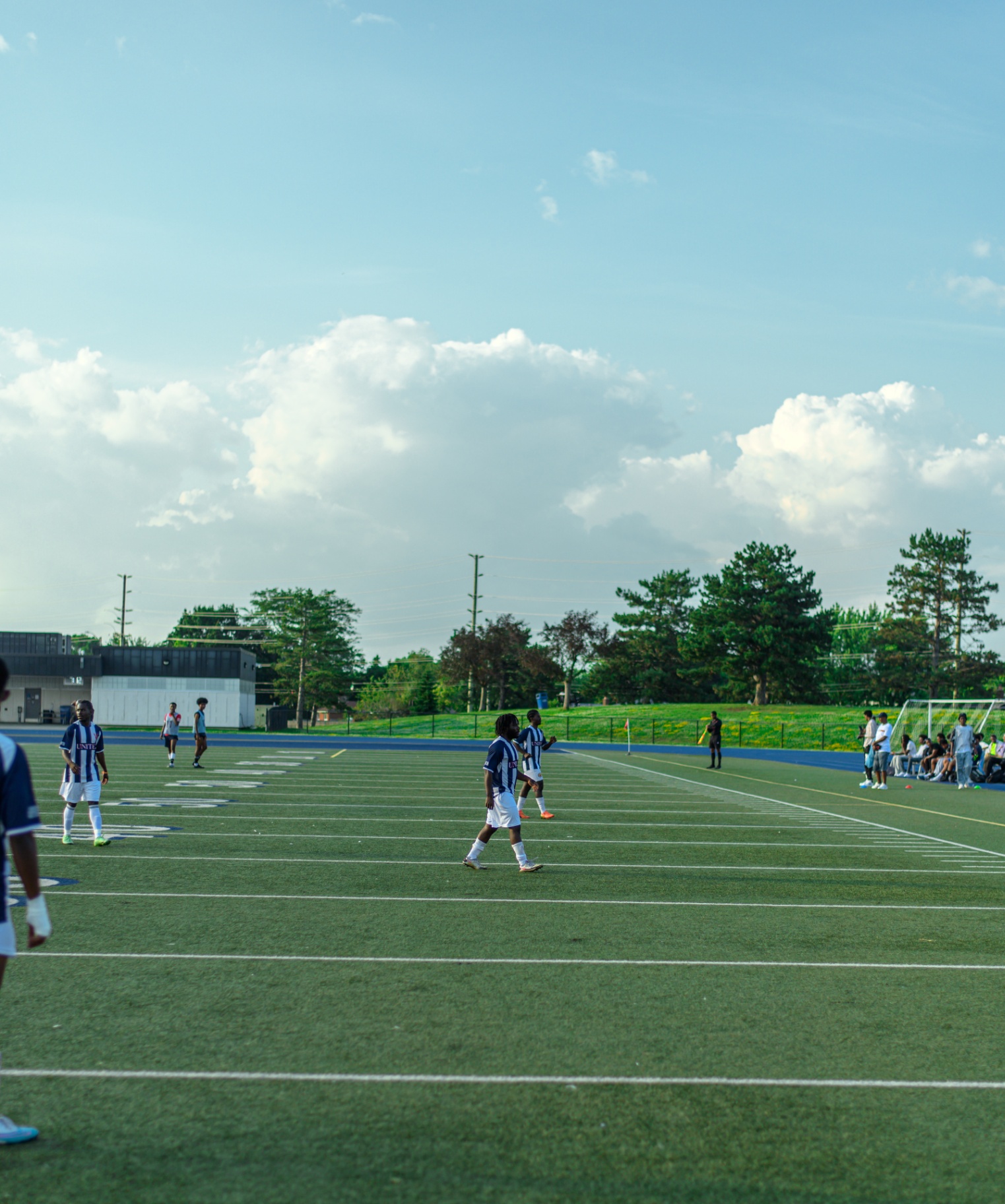 Wide view of United FC on the field at Terry Fox Stadium
