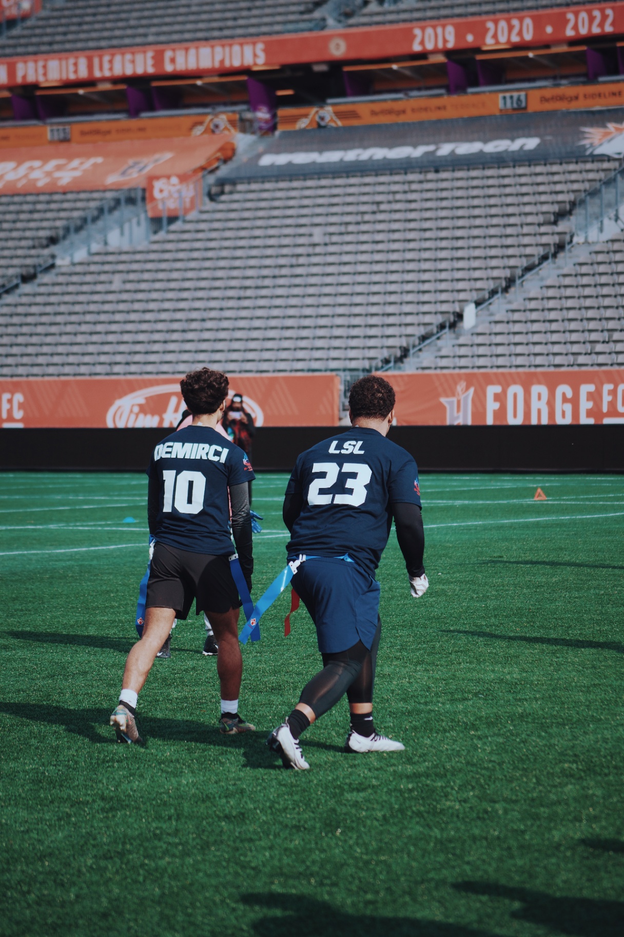Teammates DEMIRCI #10 and LSL #23 tracking the play