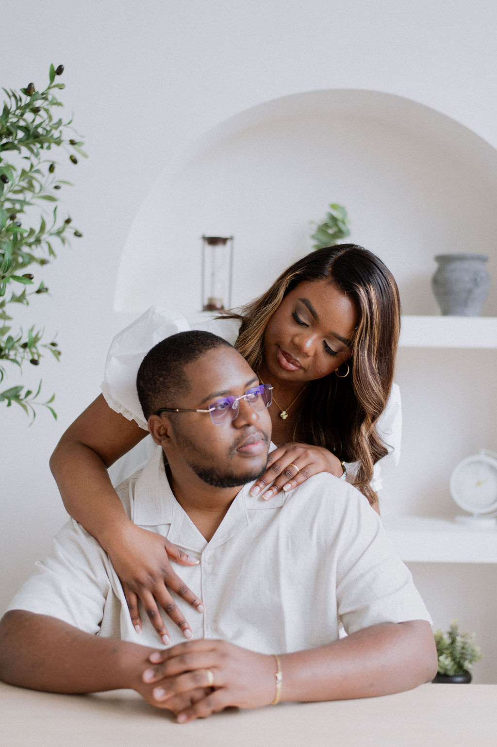 Couple in a bright studio embrace