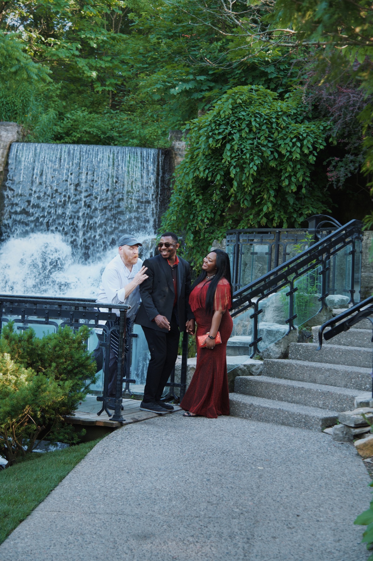 Couple laughing by the waterfall at Websters Falls