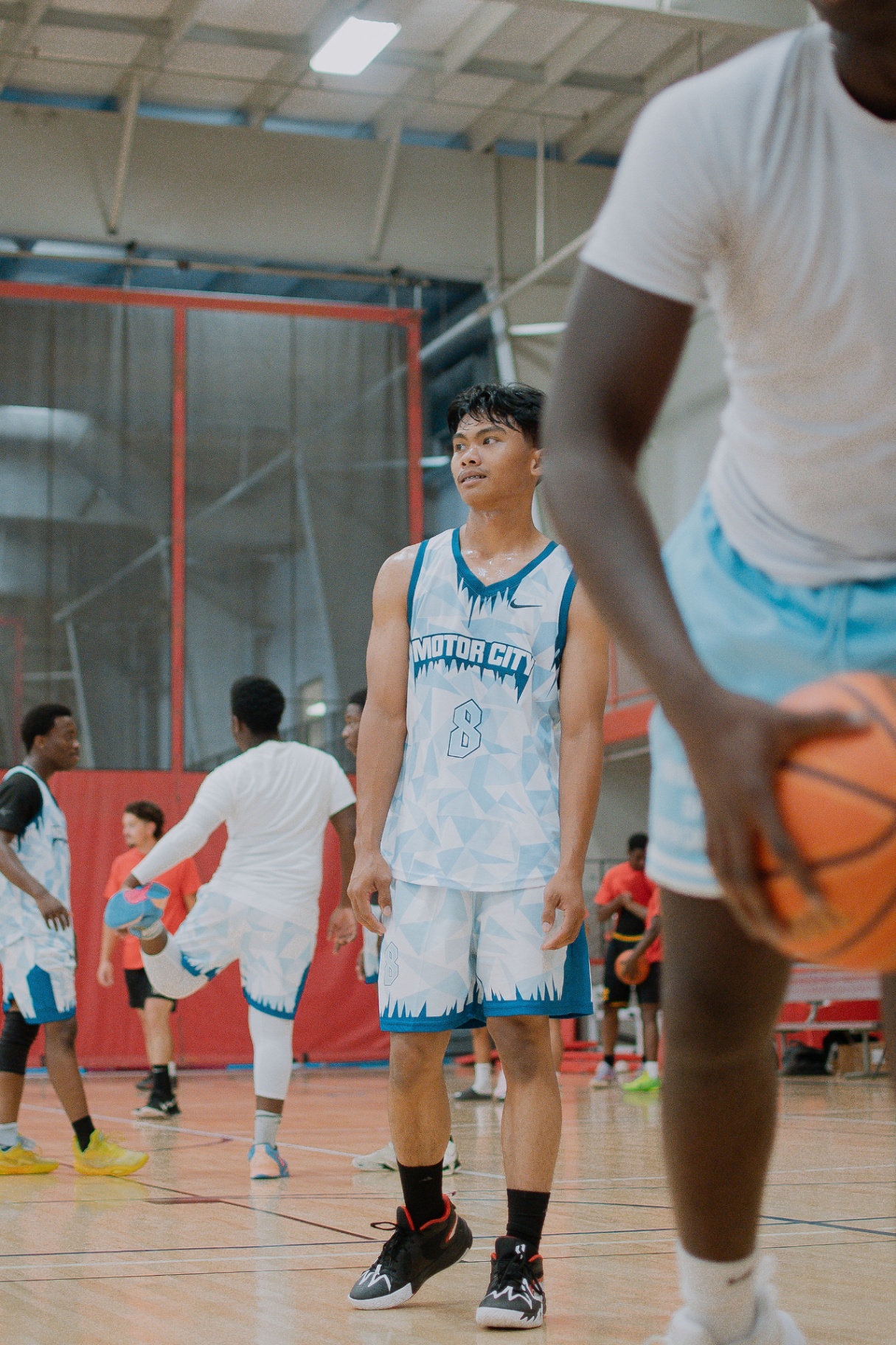 Motor City guard between plays on the hardwood