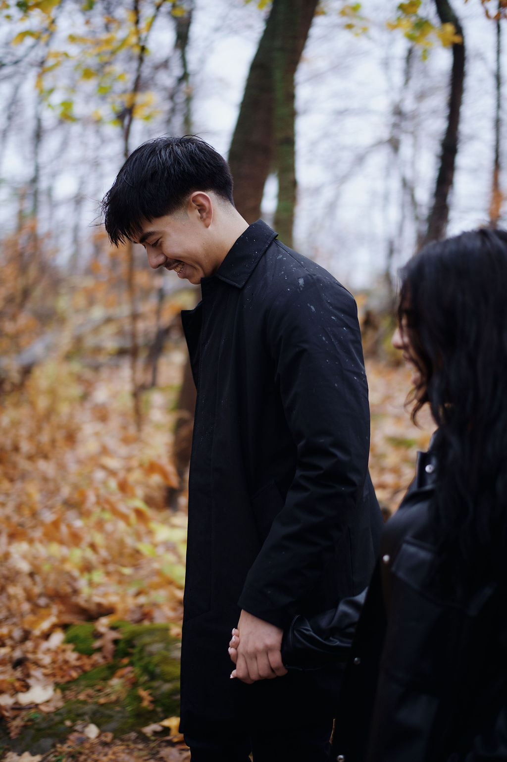 Laughing embrace in the forest
