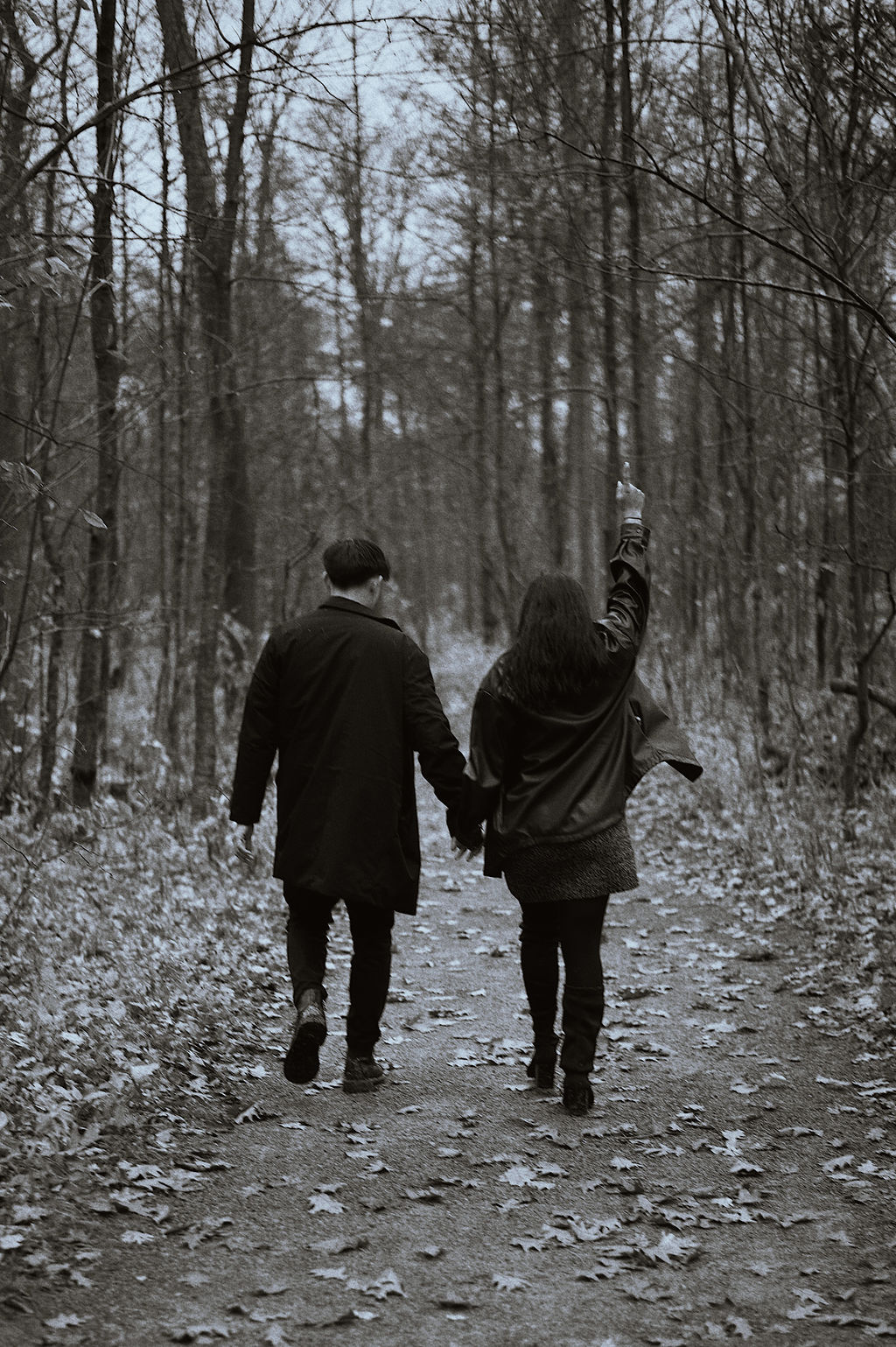 Walking away together on the leaf-strewn path