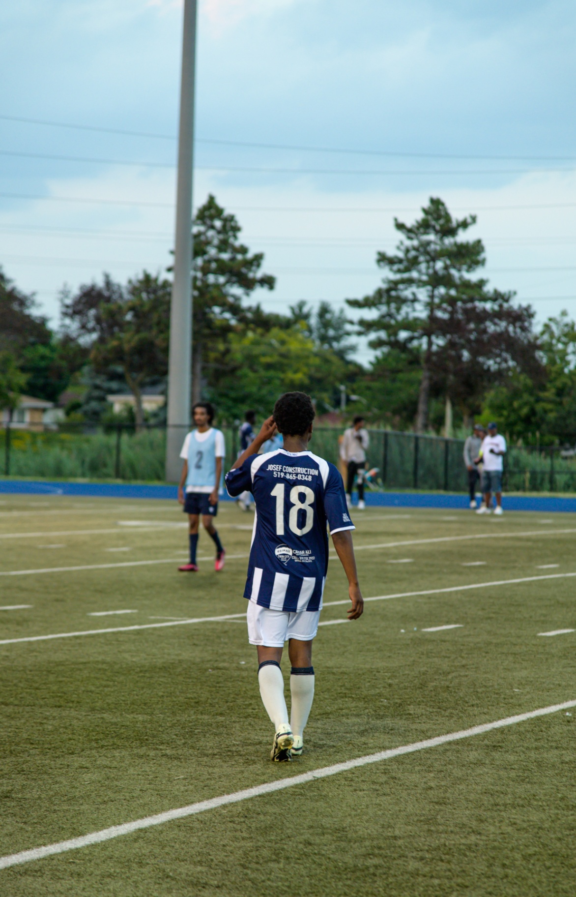 Player #18 walking the sideline