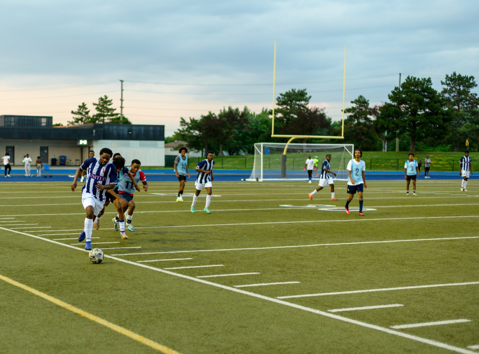 United FC forward dribbling on the counterattack