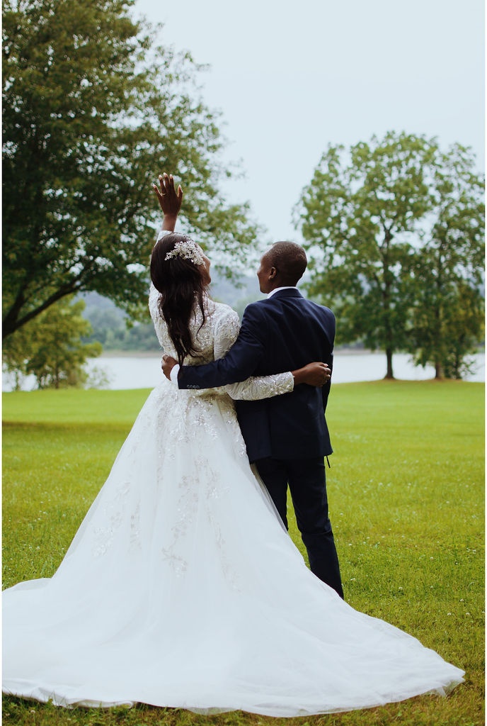 Bride and groom on the chapel lawn