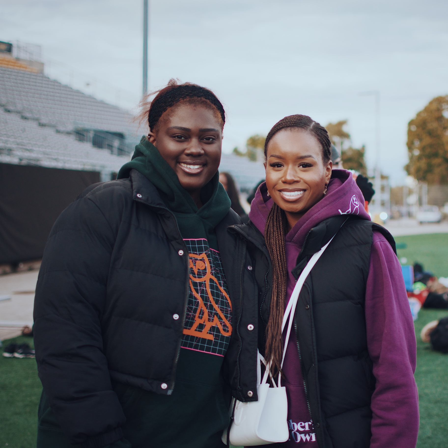 Portrait of two friends at the stadium