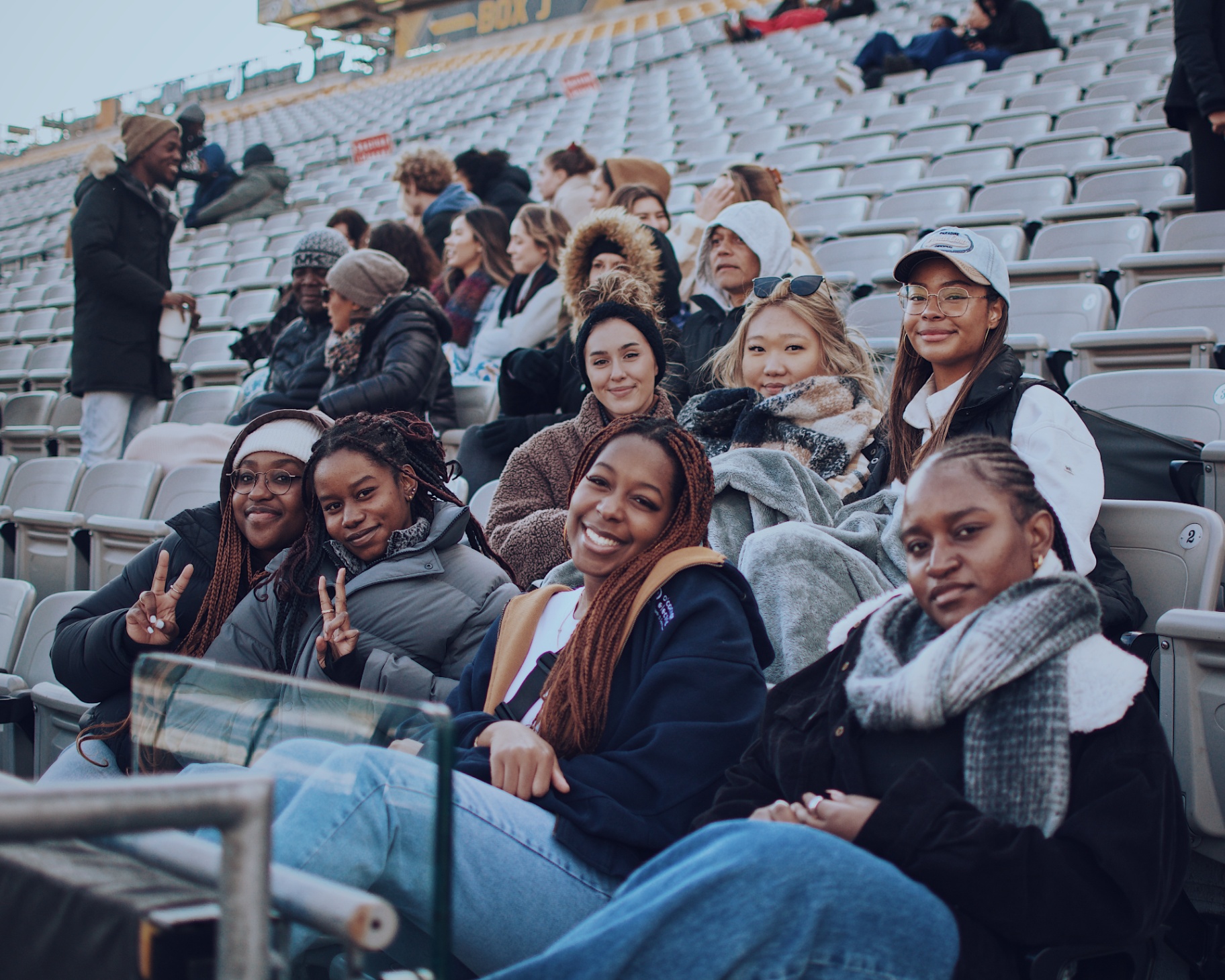 Crew taking in the game from the bleachers