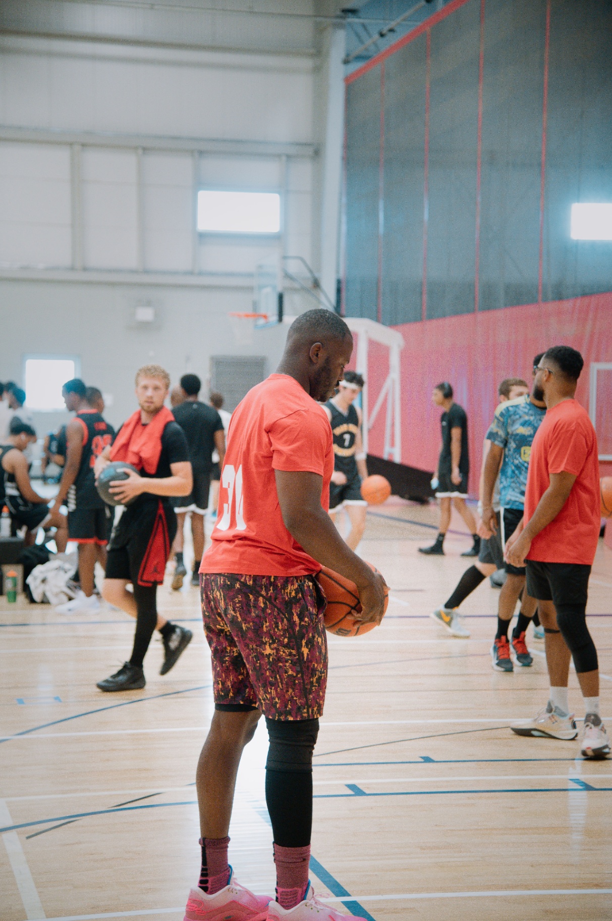 Warm-ups before tip-off across the gym