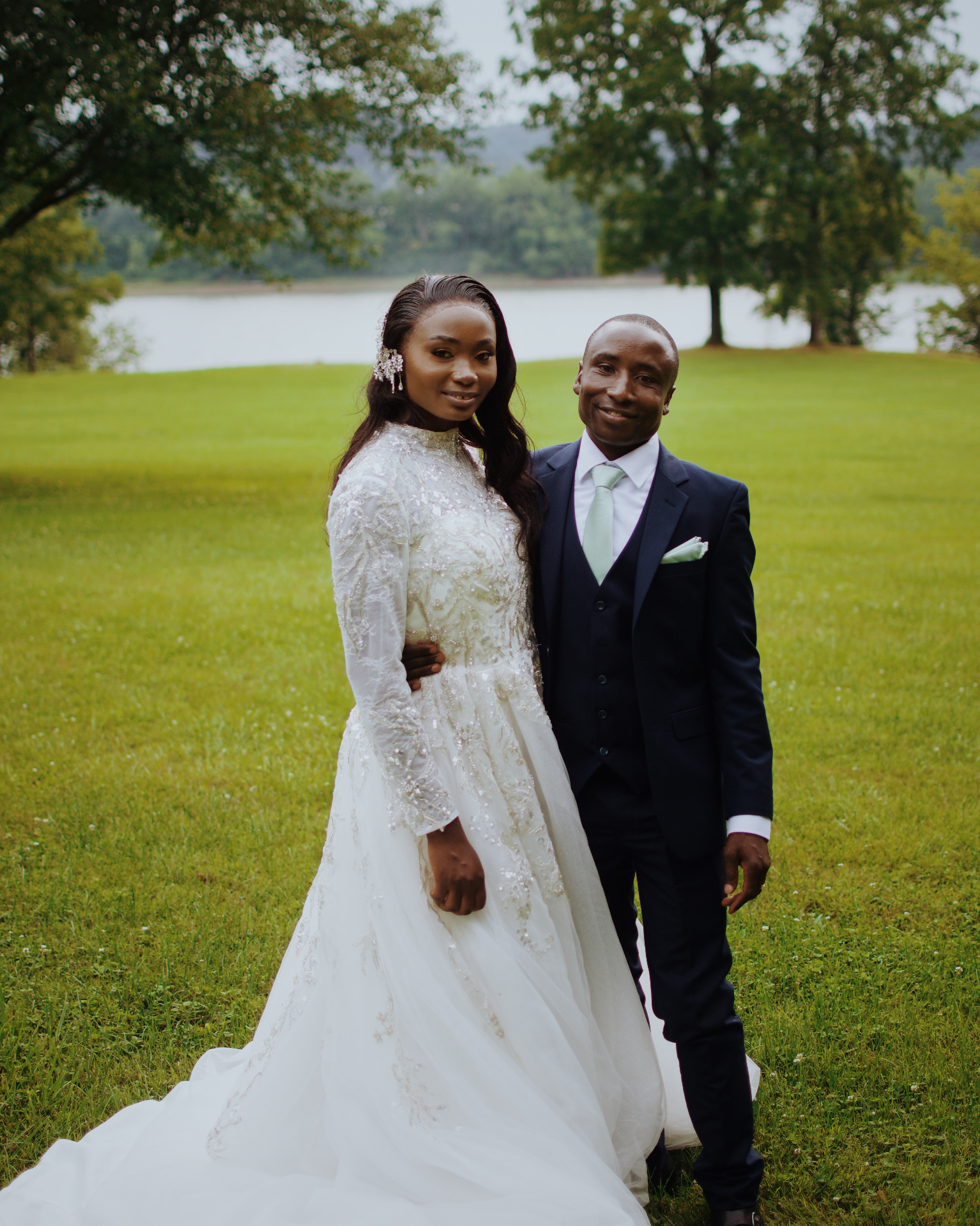 Bride and groom by the lake on their wedding day
